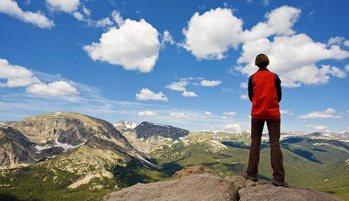 Woman looking over the tundra at Rocky Mountain National Park