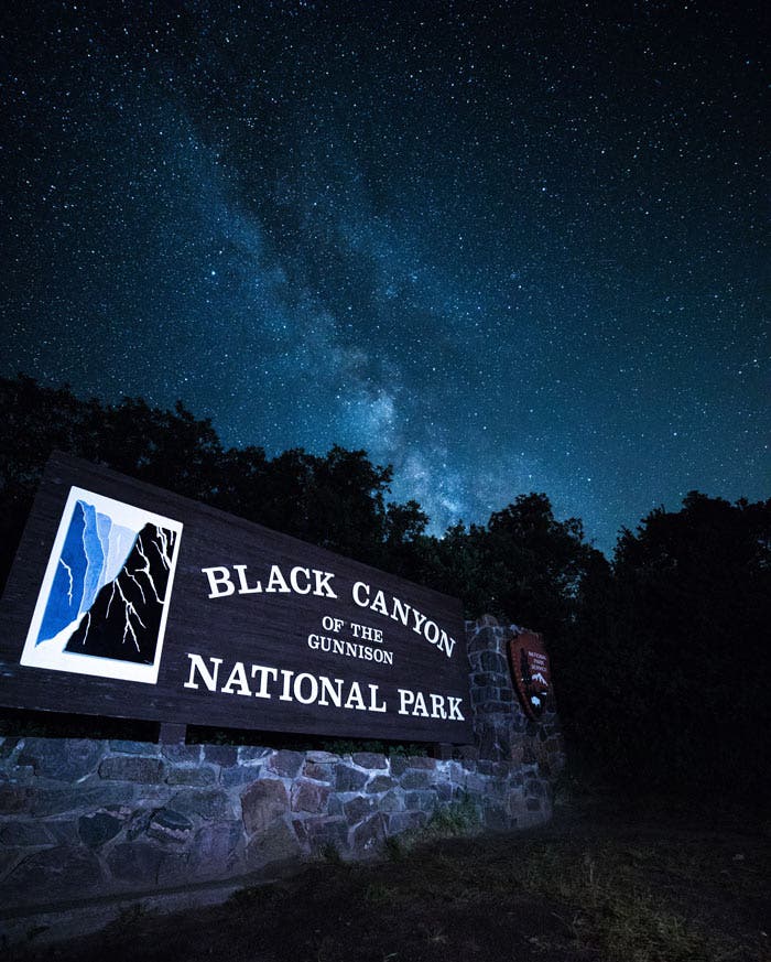 The Milky Way over the entrance sign to Black Canyon of the Gunnison National Park