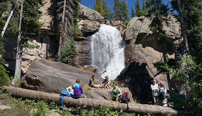 People enjoying Ouzel Falls in Rocky Mountain National Park