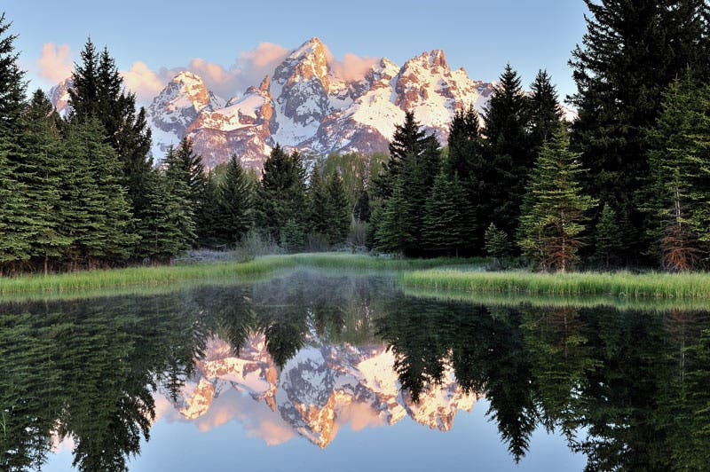 Tetons in the early morning at Schwabachers Landing in Grand Teton National Park