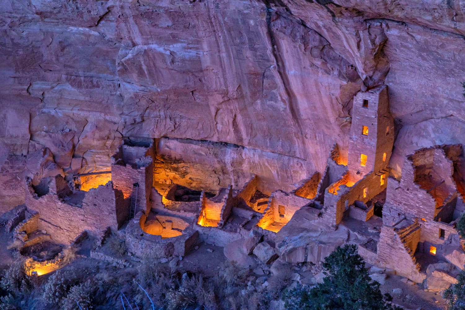 Square Tower House cliff dwelling at Mesa Verde National Park illuminated at night