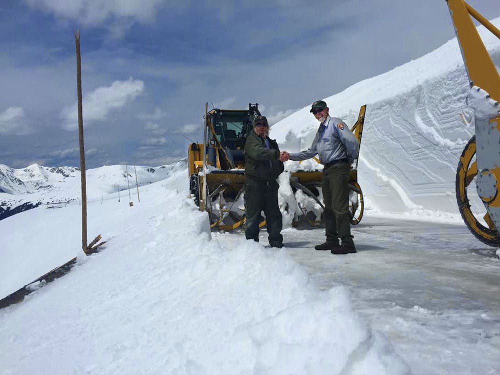 The eastbound and westbound snowplows meet on Trail Ridge Road in mid May.